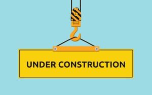 Cartoon illustration of "Under construction" signboard with crane and hook